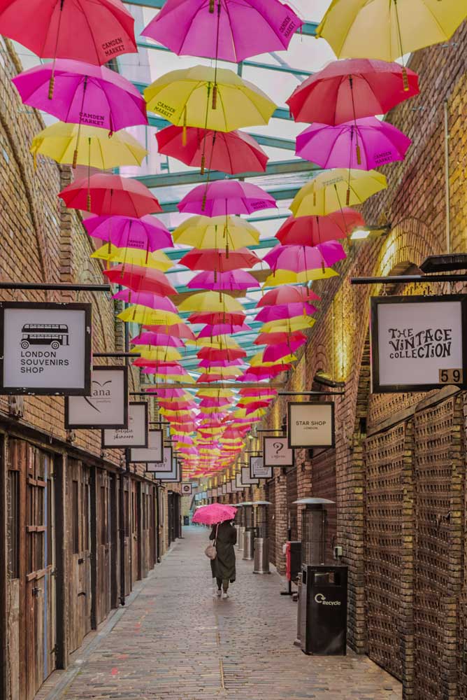 Architectural London - A woman walks under a ceiling of umbrellas, Camden Market (#ARCH_LONDON_20)